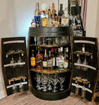 Full wine barrel bar displayed in home entertaining area with matching barrel furniture