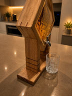 Personalised timber whiskey dispenser with engraved textured glass and silver tap in home bar setting