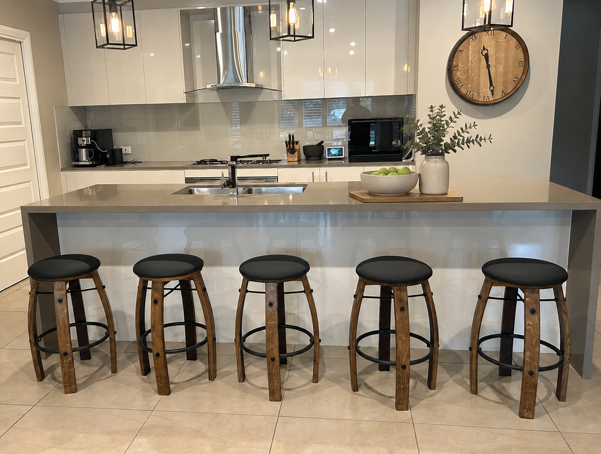 Wine barrel bar stools in a modern Australian kitchen with black padded seats