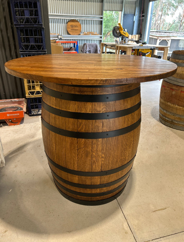 Wine barrel table with Tasmanian Oak top and matte black steel bands, handcrafted in Australia.