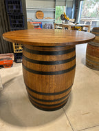 Wine barrel table with Tasmanian Oak top and matte black steel bands, handcrafted in Australia.