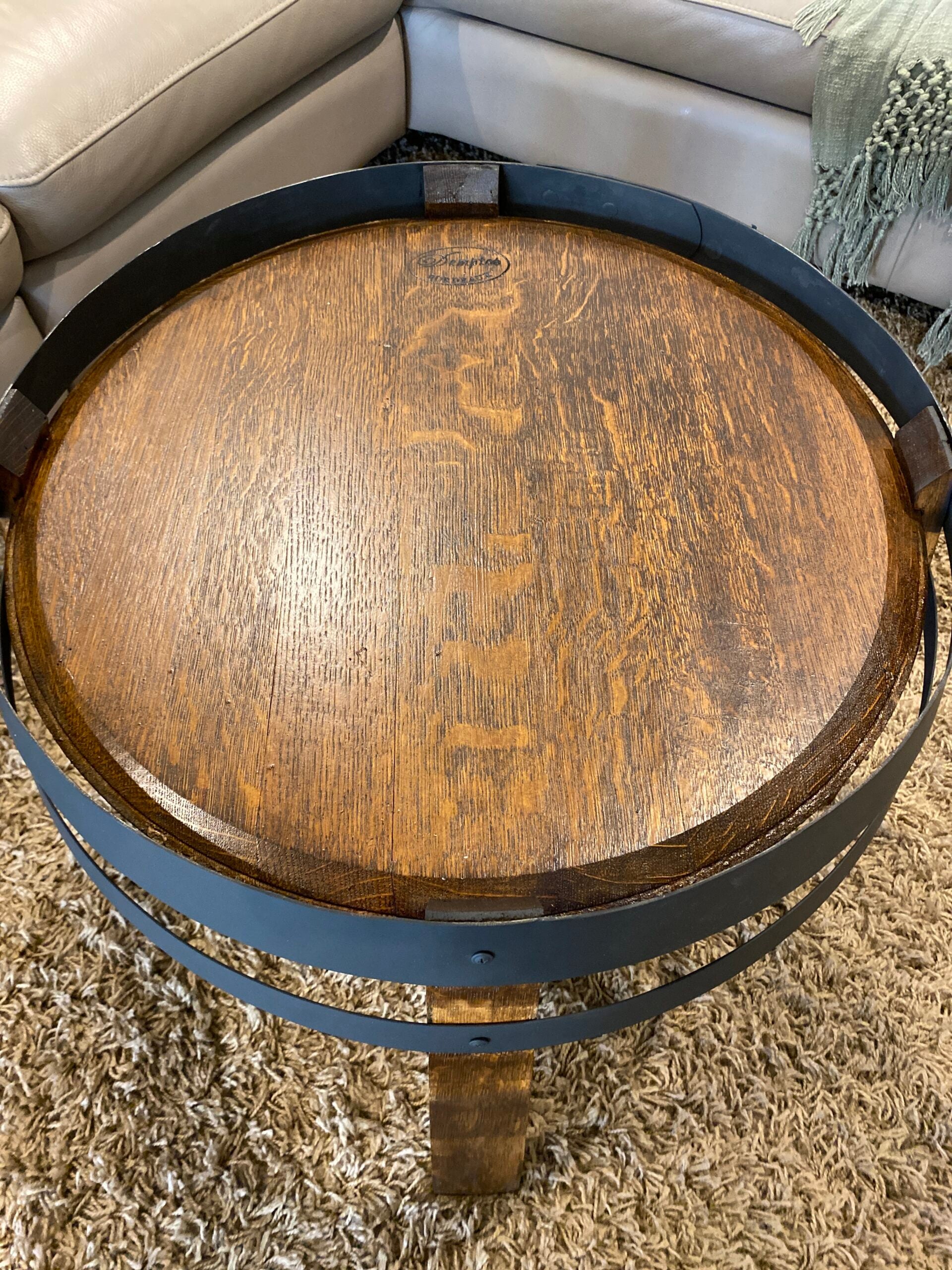 wine barrel coffee table crafted from recycled oak barrels, featuring a compact design with rustic charm – perfect for living rooms or cozy spaces