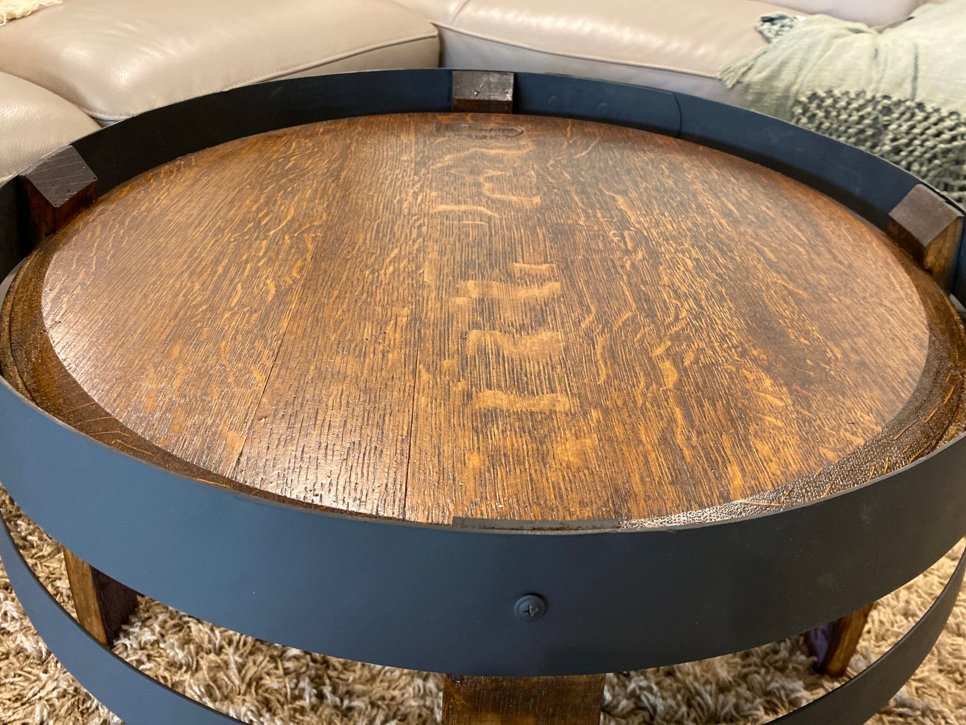 wine barrel coffee table crafted from recycled oak barrels, featuring a compact design with rustic charm – perfect for living rooms or cozy spaces