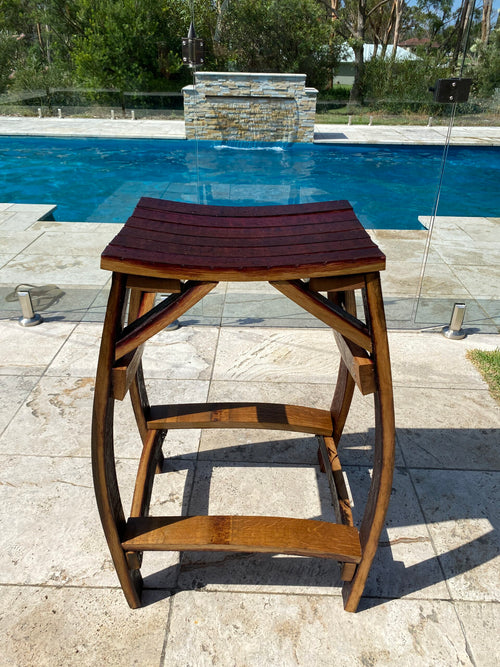 Rustic bar stools handcrafted from reclaimed wine barrels, featuring curved oak staves– perfect for kitchen or home bar seating