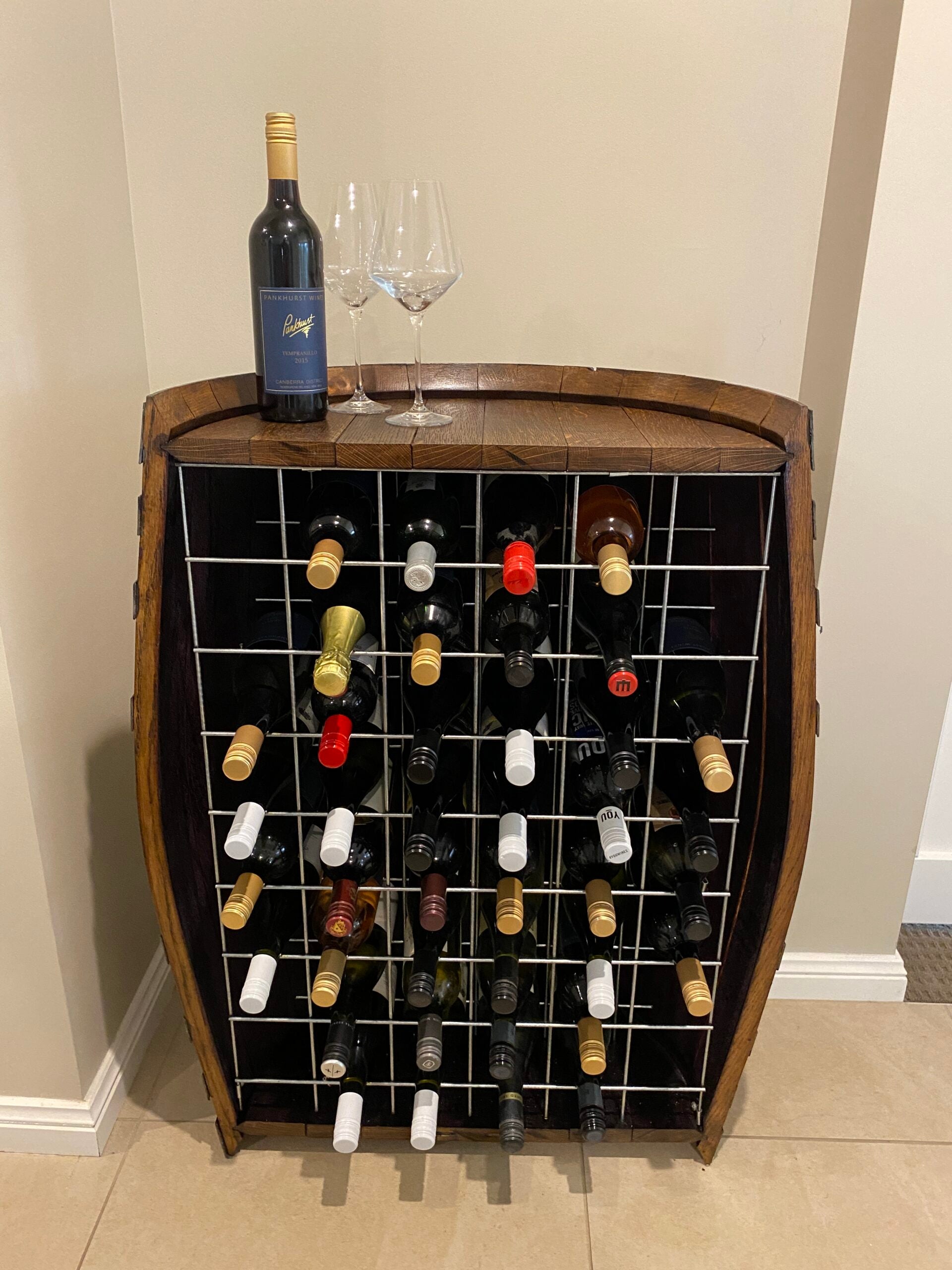 Wine barrel wine rack with over 30 bottle storage and reclaimed oak finish