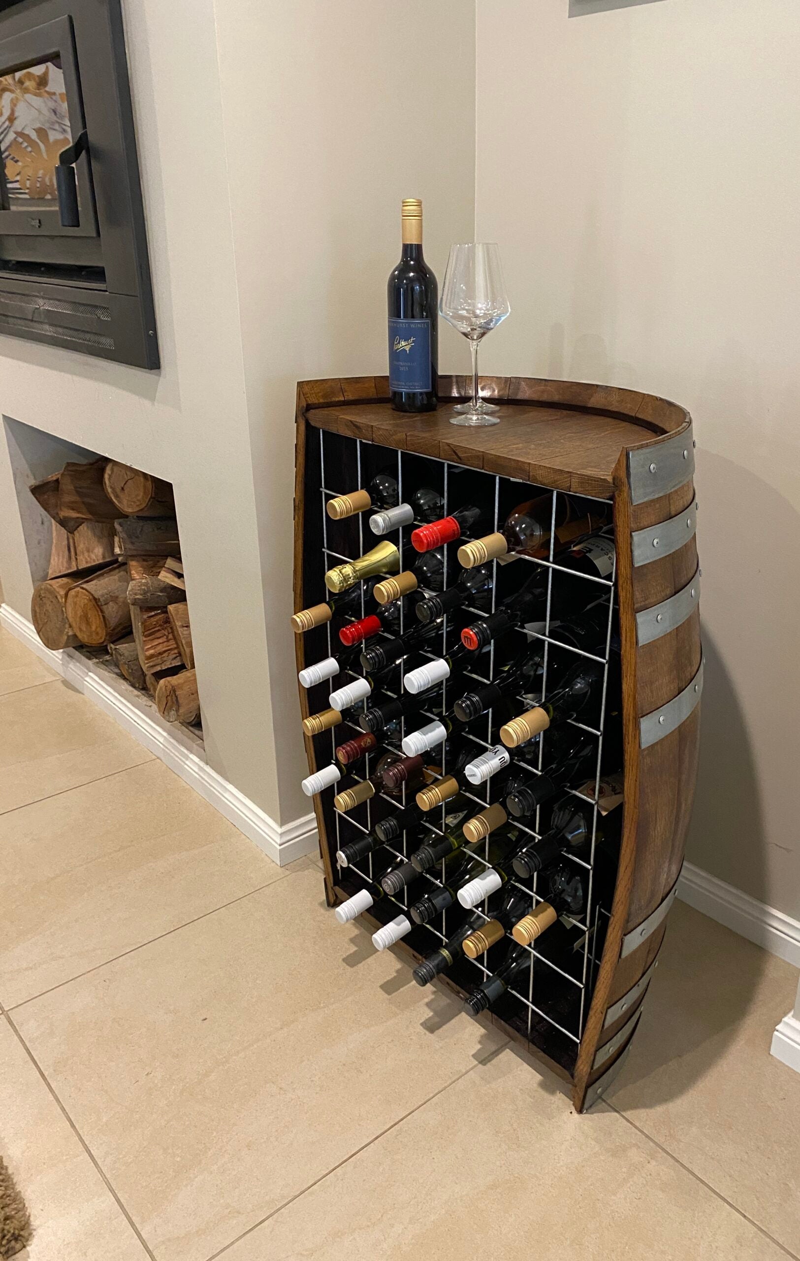 Freestanding wine barrel wine rack made from reclaimed oak, holds up to 40 bottles – rustic and sustainable wine storage solution