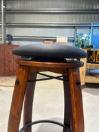 Close up of swivel mechanism on handcrafted wine barrel bar stool